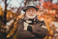 Closeup photo of cheerful retired old grey haired grandpa central park walk positive enjoy sunny day weather arms