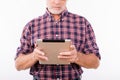 Closeup photo of a confident aged man working with tablet