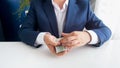 Closeup photo of corrupted offical holding money bribe in hand Royalty Free Stock Photo