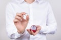 Closeup photo cropped picture of happy cheerful excited glad positive optimistic guy holding small little ring in hand with