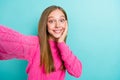 Closeup photo of cute positive sweet blonde hair girl toothy smiling hold phone shooting surprised high quality video Royalty Free Stock Photo