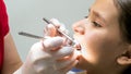 Closeup photo of dentist inspecting kids teeth with special instuments Royalty Free Stock Photo