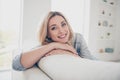 Closeup photo of domestic pretty charming blond lady relaxing sit comfy couch staying home good mood toothy smiling