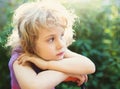 Closeup photo of a dreaming little girl outdoor