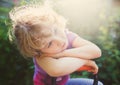 Closeup photo of a dreaming little girl outdoor