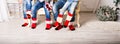 Closeup photo of family feet in wool socks