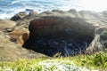 A closeup photo of the famous devils punchbowl along the Oregon Coast. A famous geological formation due to coastal erosion