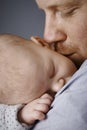 Closeup photo of father kissing newborn baby Royalty Free Stock Photo