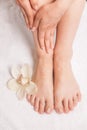 Closeup photo of female feet at spa salon on pedicure procedure. Royalty Free Stock Photo