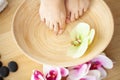 Closeup photo of a female feet at spa salon on pedicure procedure Royalty Free Stock Photo