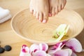 Closeup photo of a female feet at spa salon on pedicure procedure Royalty Free Stock Photo