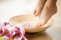 Closeup photo of a female feet at spa salon on pedicure procedure Royalty Free Stock Photo