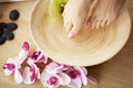 Closeup photo of a female feet at spa salon on pedicure procedure Royalty Free Stock Photo