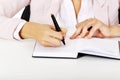 Closeup photo of female hand writing notes Royalty Free Stock Photo