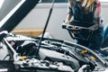 Closeup photo. female mechanic holding a scanner Royalty Free Stock Photo