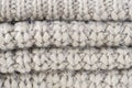 Closeup photo of folded knitted grey fabric texture Royalty Free Stock Photo