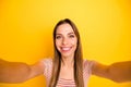 Closeup photo of funny lady good mood making selfies for social network blog toothy positive smiling wear casual striped Royalty Free Stock Photo