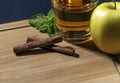 Apple juice glass with mint leaves and cinnamon