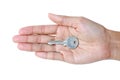 Closeup photo of hand holding keys, isolated on white background Royalty Free Stock Photo