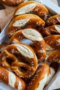 Closeup photo of handmade lye bun and pretzel in bakery