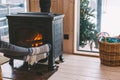 Closeup photo of human feet in warm woolen socks over fire place Royalty Free Stock Photo