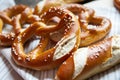 Closeup photo of lye bun and bavarian pretzel in bakery