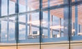 Closeup photo of modern business center.High floor office, interior in evening time. Panoramic windows facade background Royalty Free Stock Photo