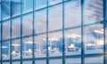 Closeup photo of modern skyscraper interior.Office floor in evening time.Panoramic windows facade background Royalty Free Stock Photo