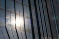 Closeup of a modern window glass building with sun reflecting in it Royalty Free Stock Photo