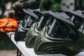 Closeup Photo of Paintball Gear Before Training At The Shooting Range. Special Protective Camouflage Mask at Table. Royalty Free Stock Photo