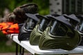 Closeup Photo of Paintball Gear Before Training At The Shooting Range. Special Protective Camouflage Mask at Table. Royalty Free Stock Photo