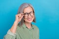 Closeup photo portrait of charming beautiful intelligent boss woman striped shirt touch specs look empty space isolated