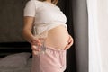 Closeup photo of pregnant woman holding glass of water, Healthy Pregnancy Royalty Free Stock Photo