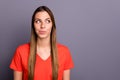 Closeup photo of pretty lady looking side empty space having funny tricky idea want to fool boyfriend wear casual orange