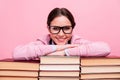 Closeup photo of pretty student lady two braids leaning hands head books pile library worker fond of reading love her Royalty Free Stock Photo