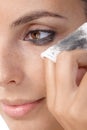 Closeup photo of removing eye makeup