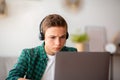 Closeup photo of serious school boy studying online