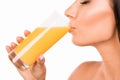 Closeup photo of sexy young woman drinking orange juice Royalty Free Stock Photo