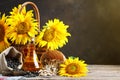 Closeup photo of sunflowers and sunflower oil with seeds on on a wooden table. Bio and organic concept of the product. Royalty Free Stock Photo