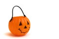 A plastic Halloween cup in the shape of a pumpkin with a face features Royalty Free Stock Photo