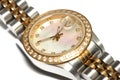 A silver ladies watch with a round watch face and diamonds on the rim Royalty Free Stock Photo