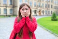 Closeup photo of thoughtful minded pensive teen girl with funny facial expression touching face thinking about bad mark