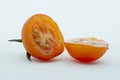 Closeup photo to a sliced cherry tomato