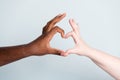 Closeup photo of two arms different race skin color multiracial couple best friends antiracism issue concept help