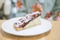 woman eating piece of cake with raspberries Royalty Free Stock Photo