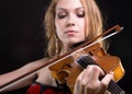 Closeup photo of woman playing the fiddle Royalty Free Stock Photo