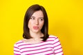 Closeup photo of young attractive nice woman looking empty space suspicious isolated on yellow color background