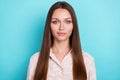 Closeup photo of young attractive pretty woman wear pink shirt looking directly you  on cyan color background Royalty Free Stock Photo