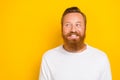 Closeup photo of young handsome cute man red beard mustache smiling look tricky empty space idea isolated on yellow