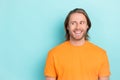 Closeup photo of young handsome funny man looking interested smile empty space advert unsure deal isolated on bright Royalty Free Stock Photo